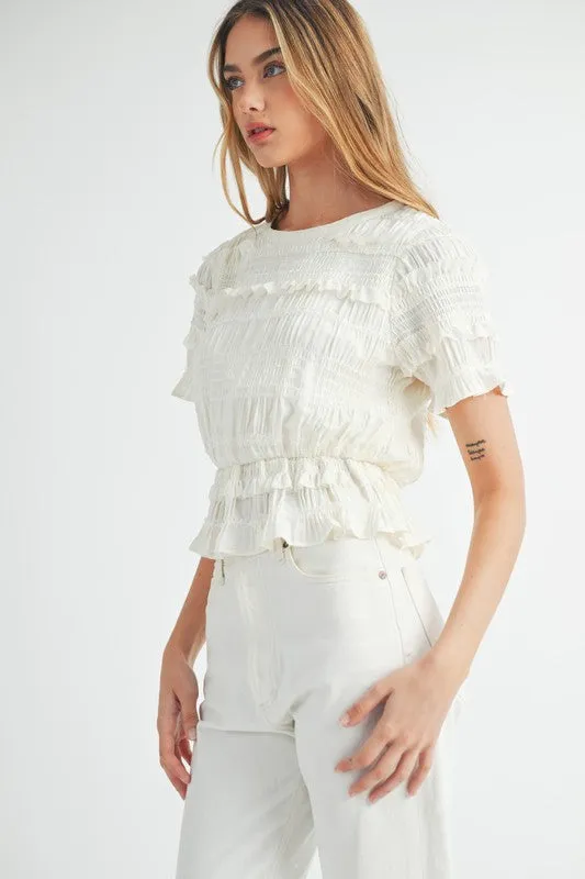 The Evelyn Smocked Ruffle Peplum Blouse