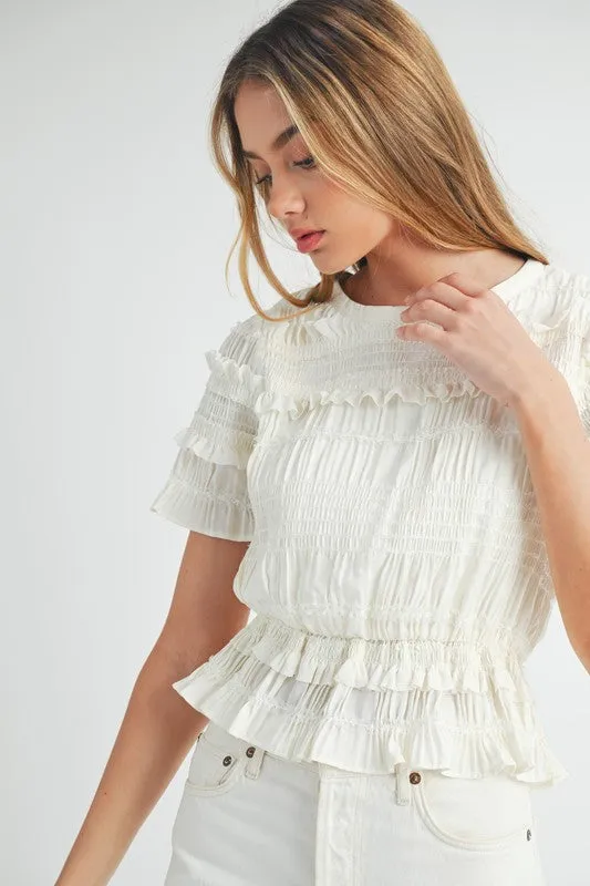 The Evelyn Smocked Ruffle Peplum Blouse