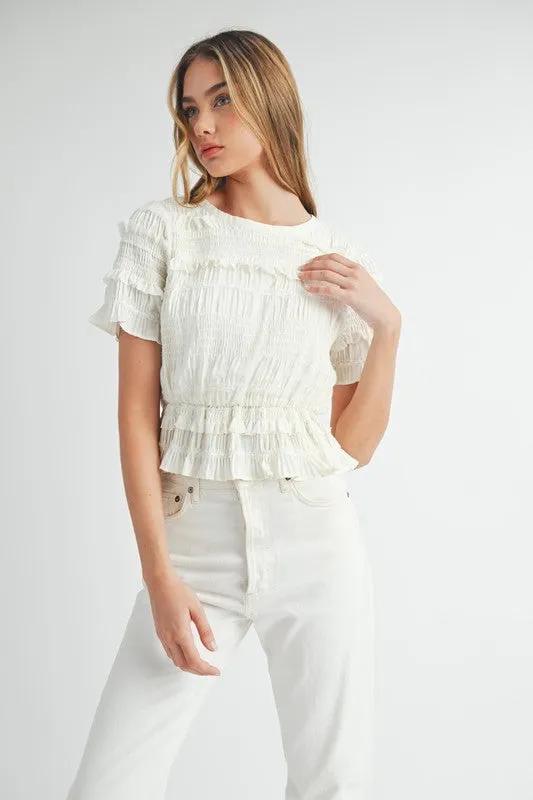 The Evelyn Smocked Ruffle Peplum Blouse