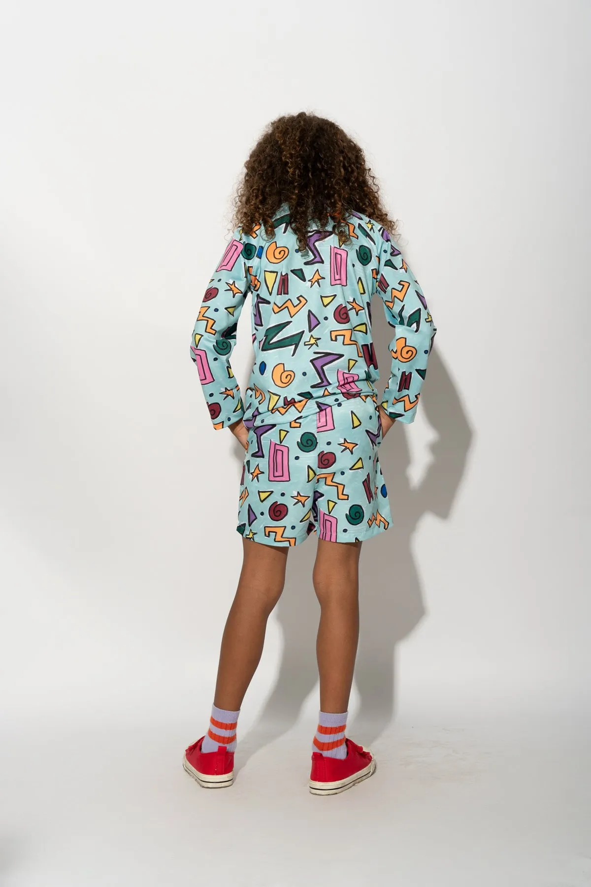 TURQUOISE SQUIGGLE PRINT LONG SLEEVE SWIM TOP